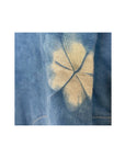 A beautiful indigo dyed linen long jacket with petal motif, detail.