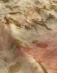 A large square silk bronze pink scarf naturally dyed floral print detail