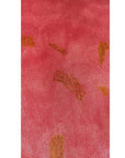 The red Lucia top naturally dyed floral print shown on a dress form, detail