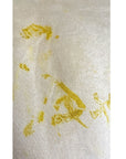 The yellow Lucia top naturally dyed floral print shown on a dress form, detail