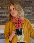 A woman wearing the rose scarf