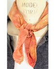 A square silk red scarf naturally dyed floral print detail