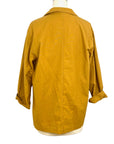 The sunrise jacket in yellow cotton linen fabric shown on a dress form, back view