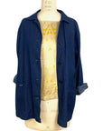 The front view of the blue denim sunrise jacket with scarf