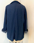The back view of the blue denim sunrise jacket with scarf
