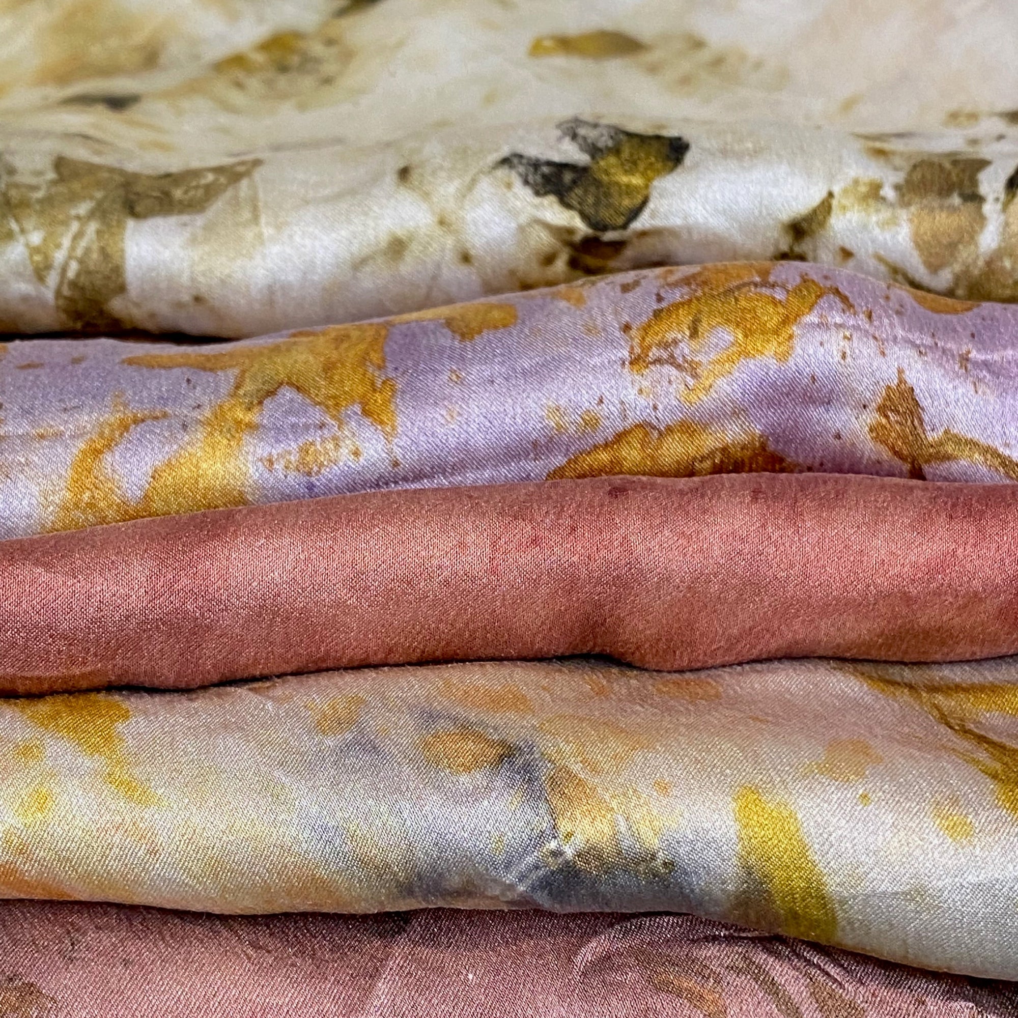 Stack of botanically dyed scarves