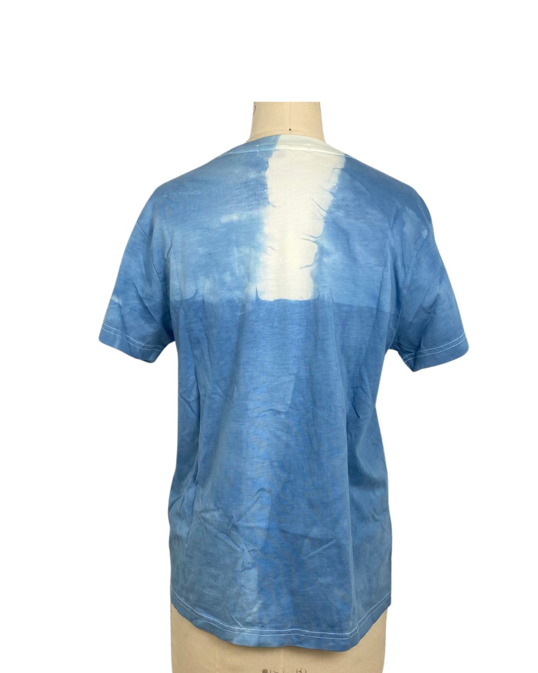 A beautiful blue hand dyed t shirt with a block back view.