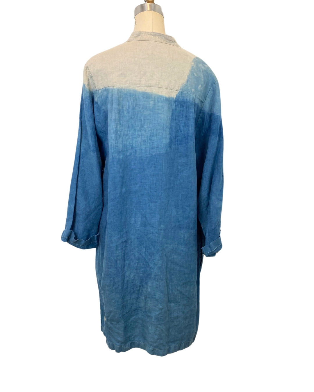 A beautiful indigo dyed linen long jacket with petal motif, back view.