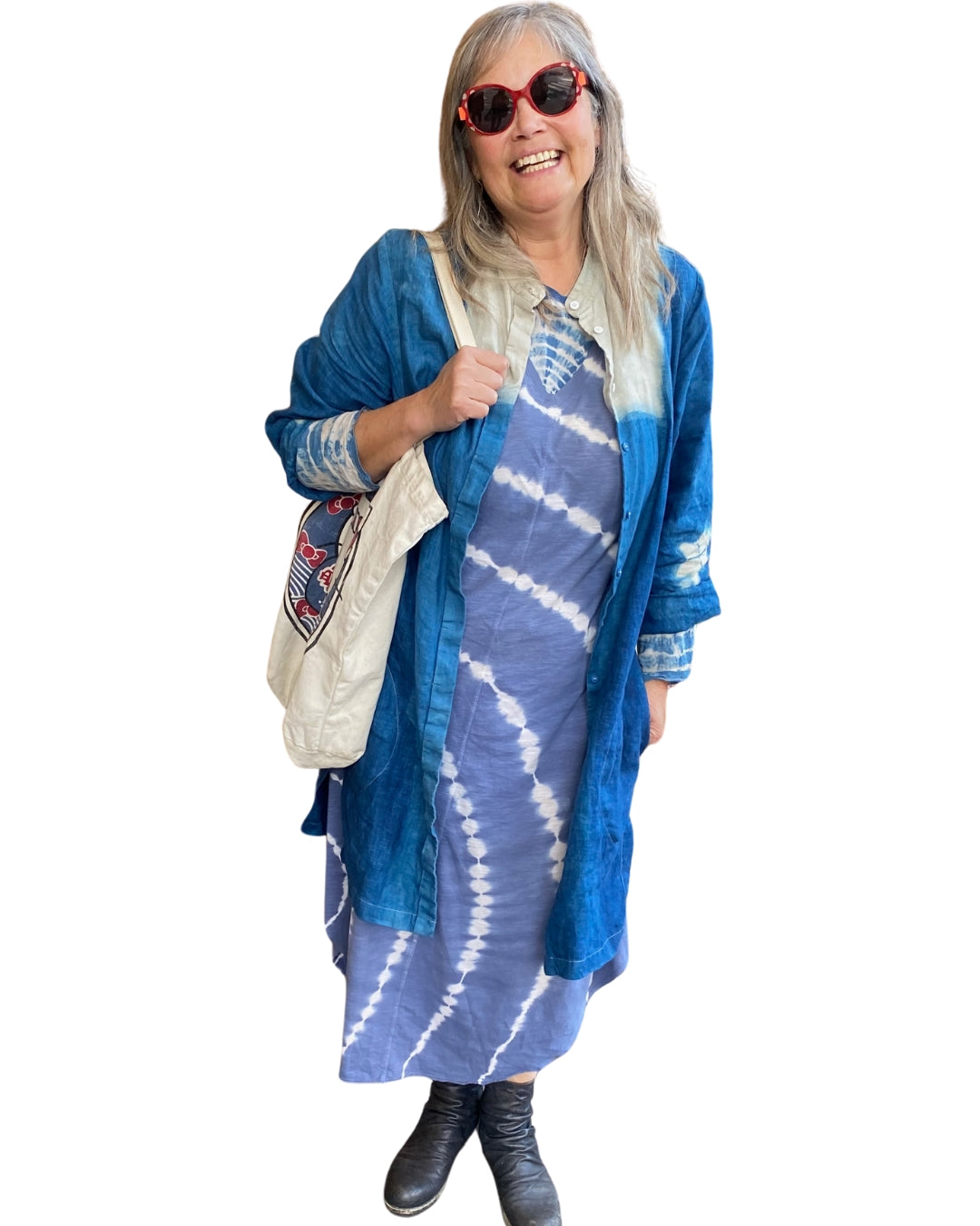 A woman wearing the Halley Linen Jacket over a dress.