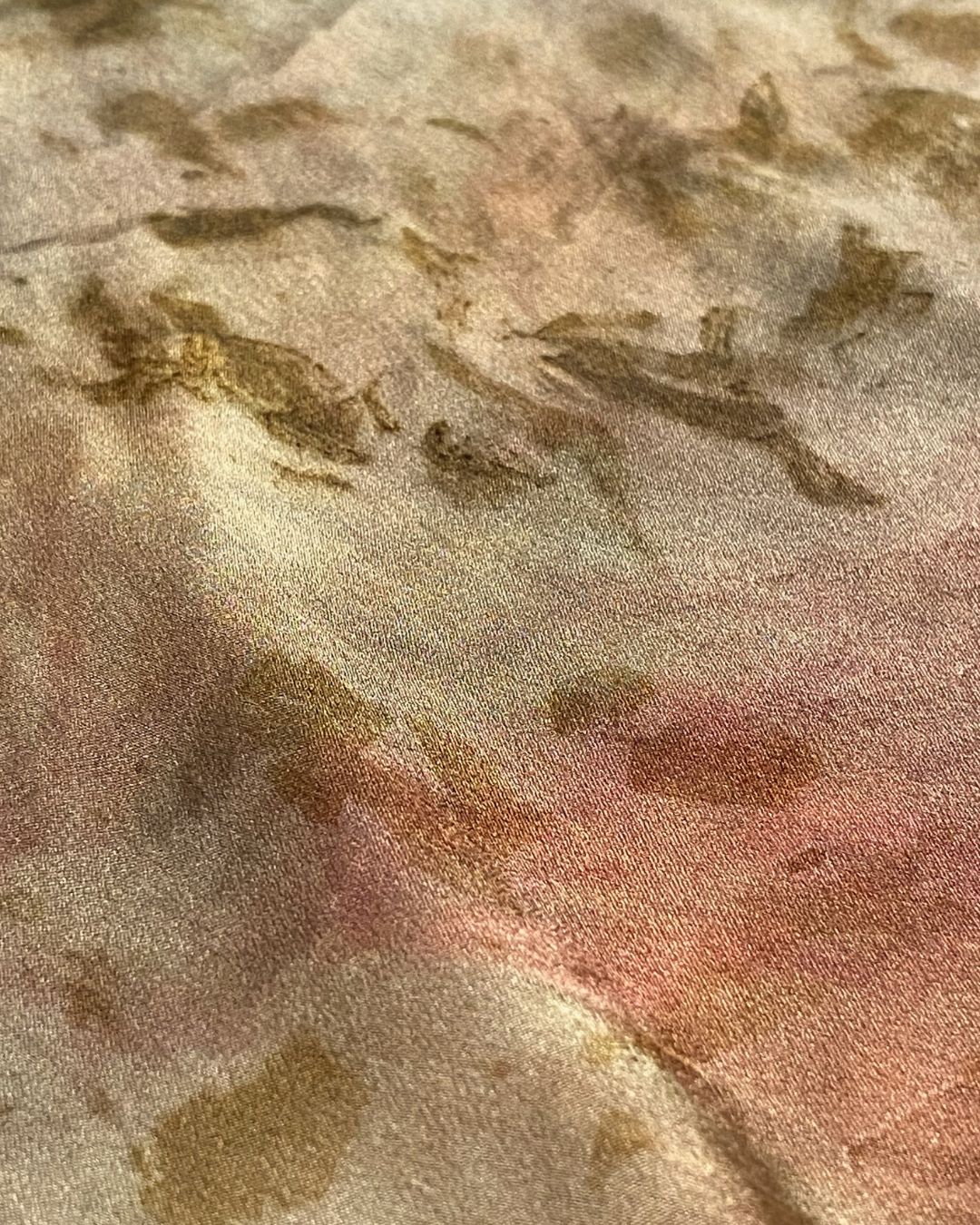 A large square silk bronze pink scarf naturally dyed floral print detail