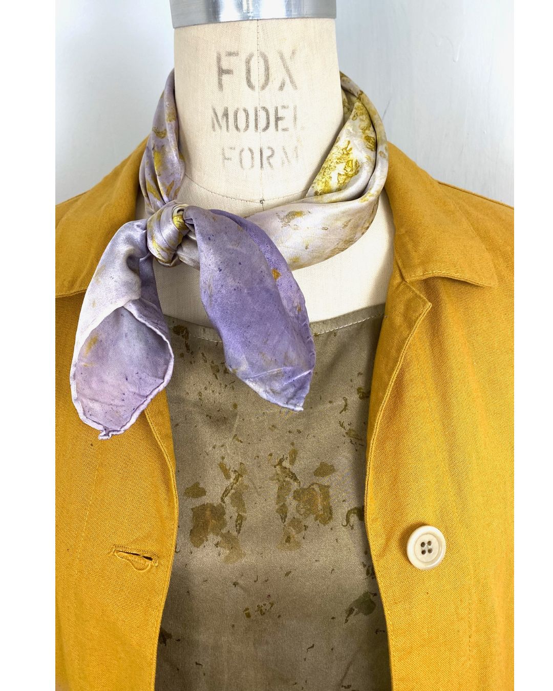 The olive green Lucia top naturally dyed floral print shown styled with a silk scarf