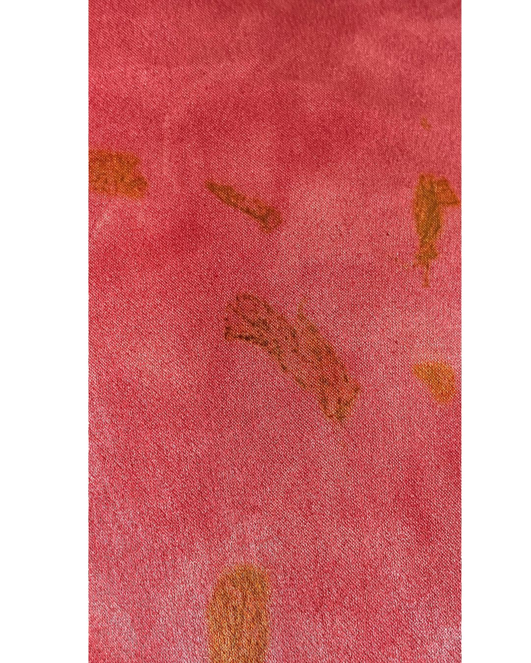The red Lucia top naturally dyed floral print shown on a dress form, detail