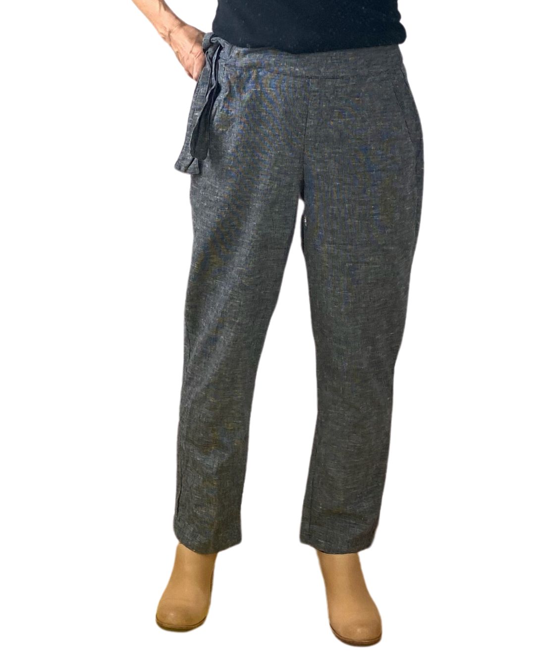 A woman wearing the black crop Nico pant, front view.