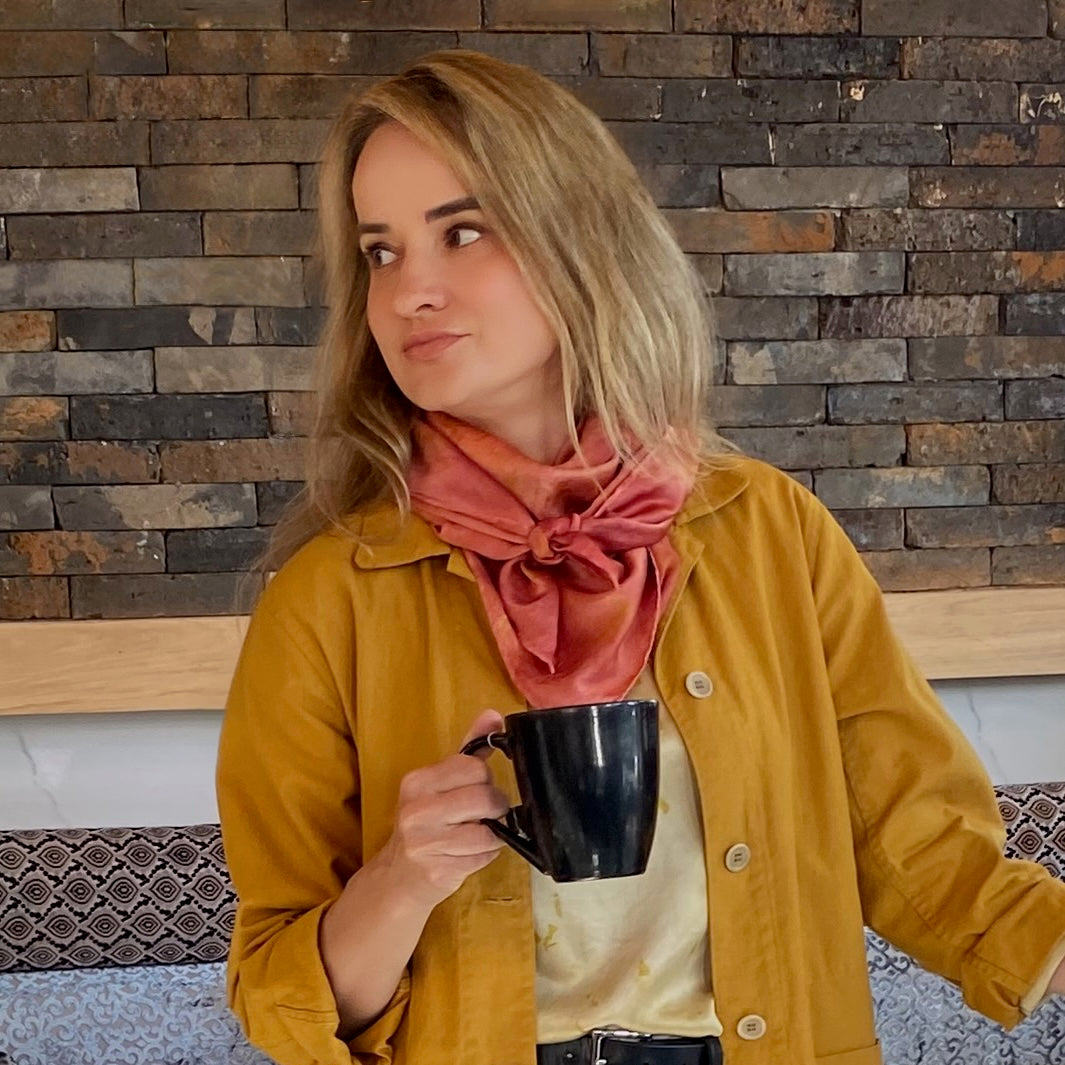 A woman wearing the rose scarf