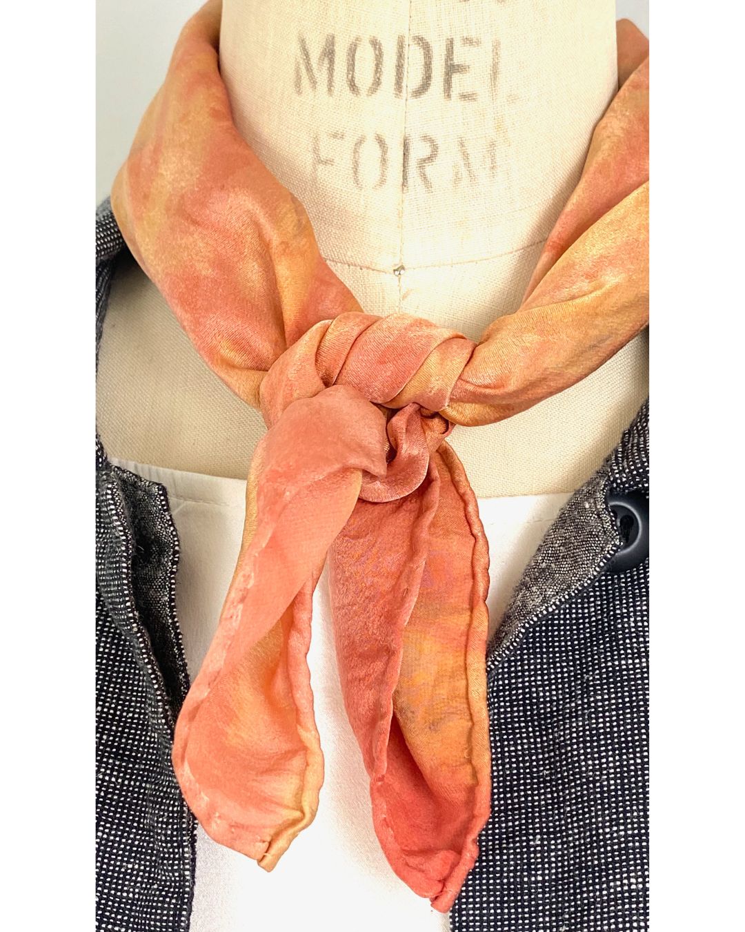 A square silk red scarf naturally dyed floral print detail