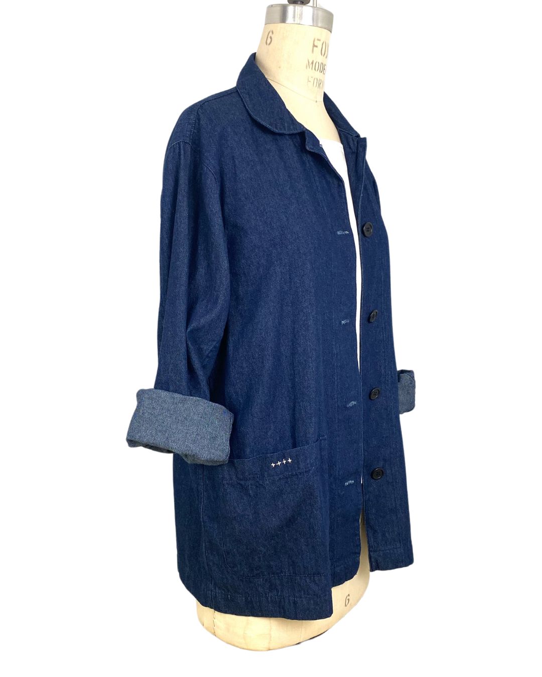 The side view of the blue denim sunrise jacket