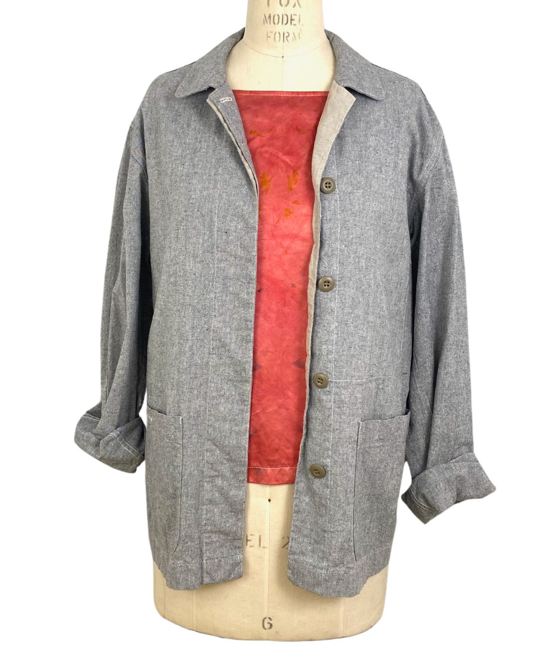 The sunrise jacket in light grey organic cotton and hemp shown on a dress form, front view