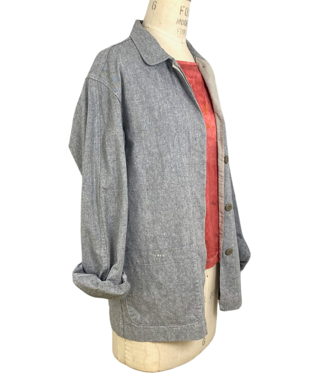 The sunrise jacket in light grey organic cotton and hemp shown on a dress form, side view