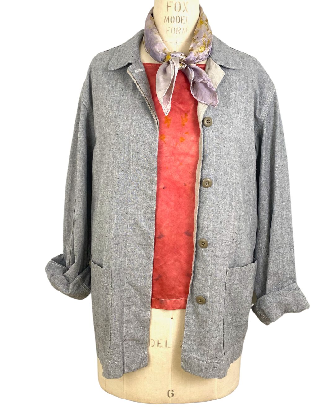 The sunrise jacket in light grey organic cotton and hemp shown on a dress form, front view