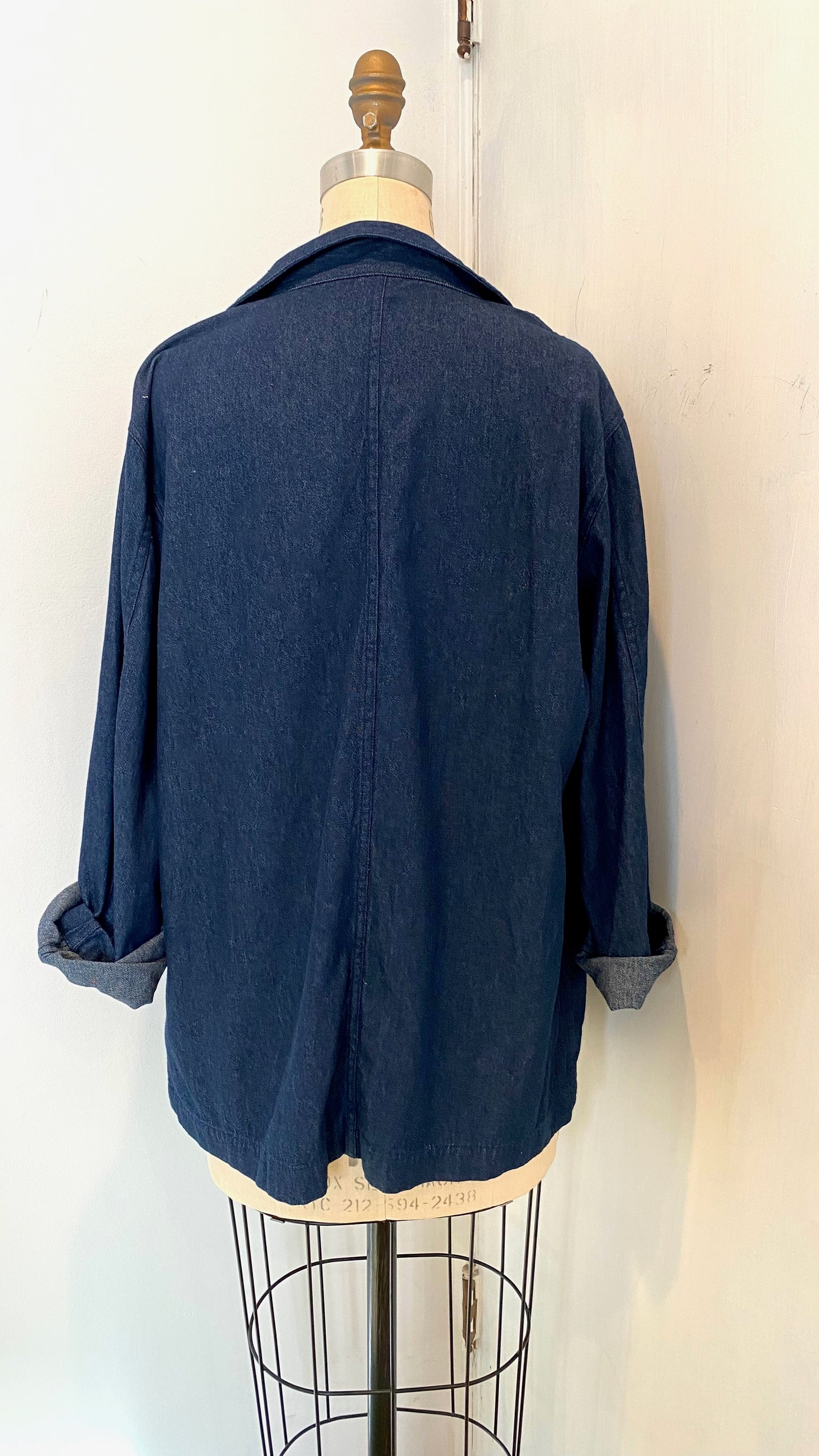 The back view of the blue denim sunrise jacket with scarf